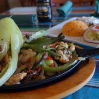 Tacos Pescados · Choice of tortillas filled with jicama slaw, avocado, pico De gallo and choice of Deep fried...