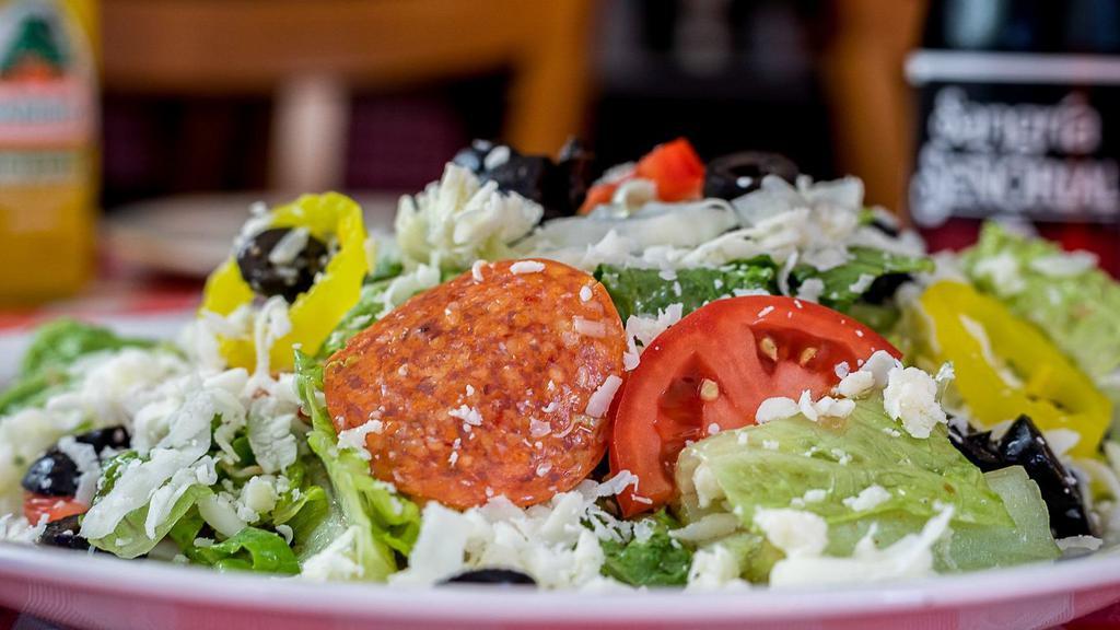 Antipasto Salad · Fresh chopped romaine lettuce, pepperoni, black olives, mozzarella cheese, red onions, tomatoes, pepperoncini, tossed in a savory vinaigrette.