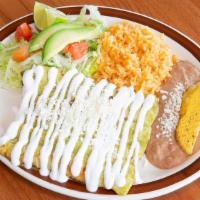 Veggie Enchiladas · Three enchilada served with rice, beans, and red or green salsa.