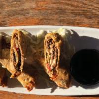 Cheese Steak Egg Rolls · Beef, American cheese, red pepper, Anaheim peppers and onion all rolled up in a wonton wrapp...