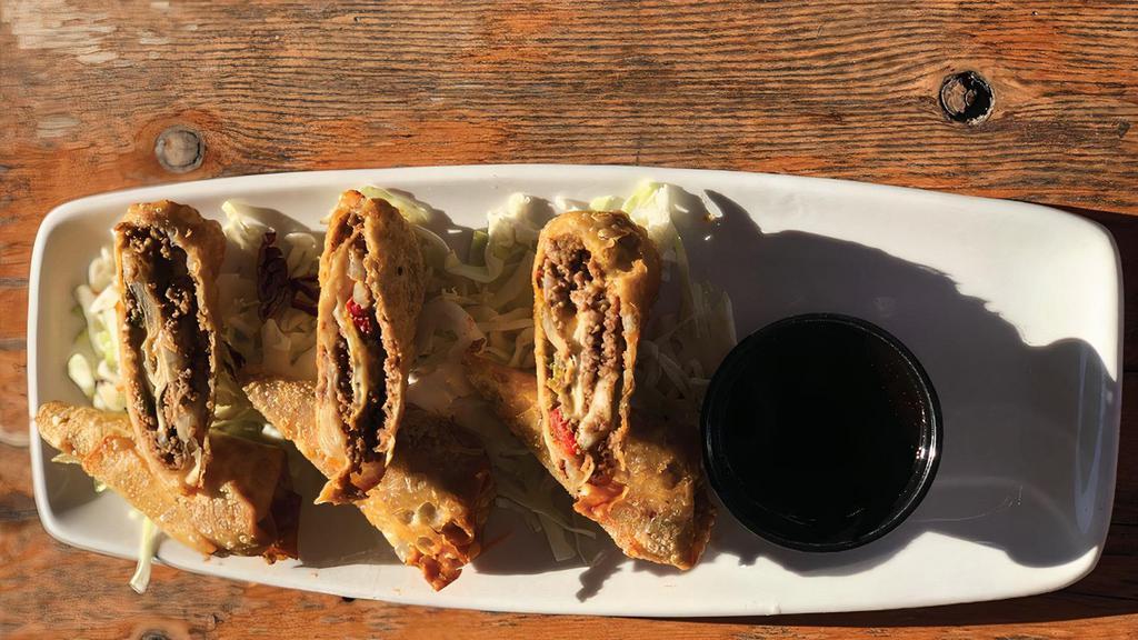 Cheese Steak Egg Rolls · Beef, American cheese, red pepper, Anaheim peppers and onion all rolled up in a wonton wrapper and served with Honey Sriracha.