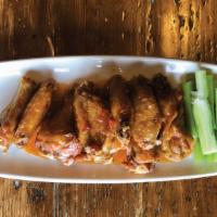 Wings · 10 bone-in wings served with celery and Maytag blue cheese dressing; with your choice of win...