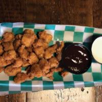 Popcorn Chicken · Bite-sized nuggets of chicken coated in a seasoned breading and deep fried. Try them tossed ...
