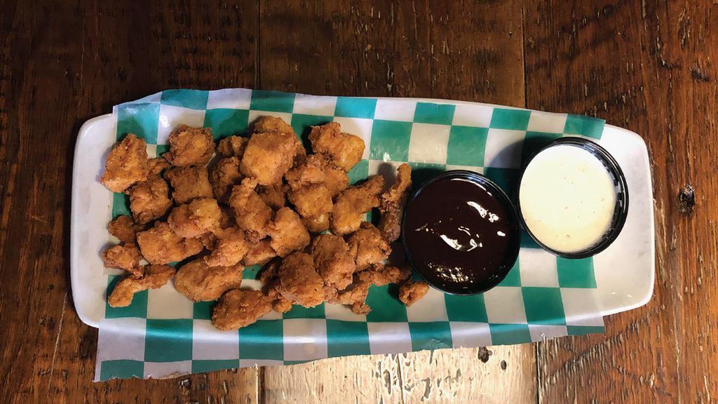 Popcorn Chicken · Bite-sized nuggets of chicken coated in a seasoned breading and deep fried. Try them tossed in your favorite wing sauce!