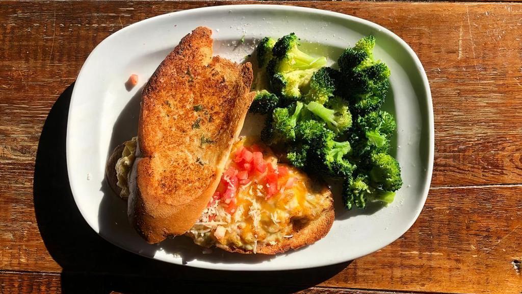 Lobster Melt · Lobster mixed with artichokes, mayo, onion and parmesan, topped with melted cheddar and diced tomato. Served on garlic crostini.
