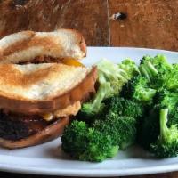 Bbq Meatloaf Sandwich · Grilled artisan meatloaf with Bourbon BBQ sauce, crispy onions and cheddar on thick cut whit...
