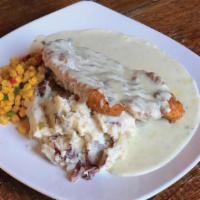 Chicken Fried Chicken · Cracker crusted chicken breast covered with gravy. Served with Yukon Gold smashed potatoes a...