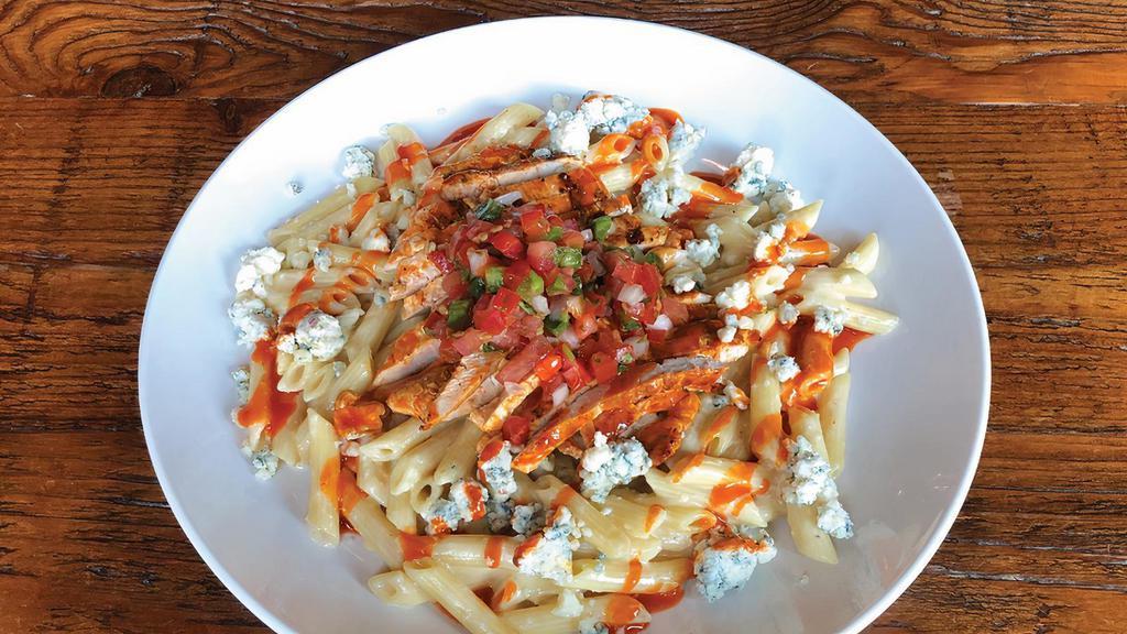 Buffalo Chicken Mac & Cheese · Roasted cauliflower cheese sauce with pepper jack cheese, cheddar and blue cheese. Topped with buffalo grilled chicken, blue cheese crumbles and pico de gallo.