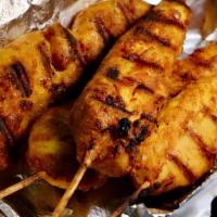Four Piece Chicken Satay · Golden and grilled chicken skewers. Served with our peanut sauce. Gluten free.