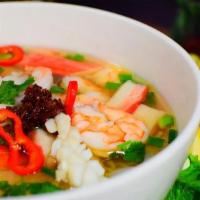Thai Fresh Seafood Pho · Rice noodle soup cooked in a savory broth, topped with green onion, cilantro, frice garlic a...