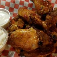 Chicken Wings · Deep-fried chicken wings with your choice of sauce.