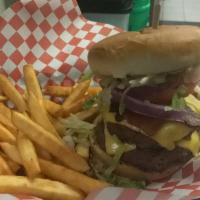 Rodeo Burger · Topped with two thick-cut golden – fried onions rings, melted american cheese and applewood ...