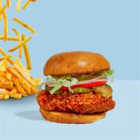 Hot Chix Fried Chicken Sandwich · Crispy fried chicken, sliced tomatoes, shredded lettuce, jalapenos, and hot sauce wrapped in...