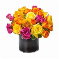 Bright Abundance By Bloomnation™ · This cylindrical vase of flowers is kind of like a time capsule, if time were made of flower...