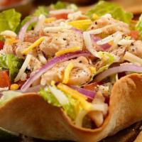 Taco Salad · Flour tortilla bowl filled with ground beef or chicken, cheese beans, lettuce, pico de gallo...