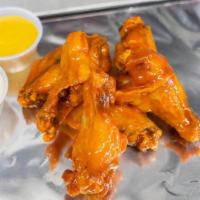 Regular Wings 18 · Our delicious 18 piece JUMBO chicken wings come with your favorite sauce of choice and a sid...