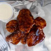 8 Boneless Wings · Our delicious Breaded  Boneless chicken wings come with your favorite sauce of choice and a ...
