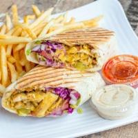 Chicken Shawarma Wrap · Marinated chicken cooked to perfection served with romaine lettuce, onions, tomato, tahini s...