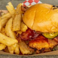 Henny Penny · 6oz breaded & deep-fried chicken breast tossed in burrow sauce, topped with bacon, house-mad...