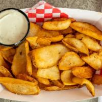 Potato Dippers · Basket of potato dippers served with seasoned sour cream.