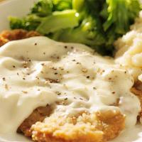 Country Fried Steak · Tender steak breaded in our signature seasoned flour, cooked to a golden brown, and topped w...