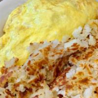 Marko'S Omelette · Our three-egg omelette stuffed with ham, turkey, bacon, sausage, green peppers, onions and c...