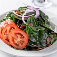 Spinach Salad · Warm goat cheese, red onion, and our very own bacon-balsamic vinaigrette.