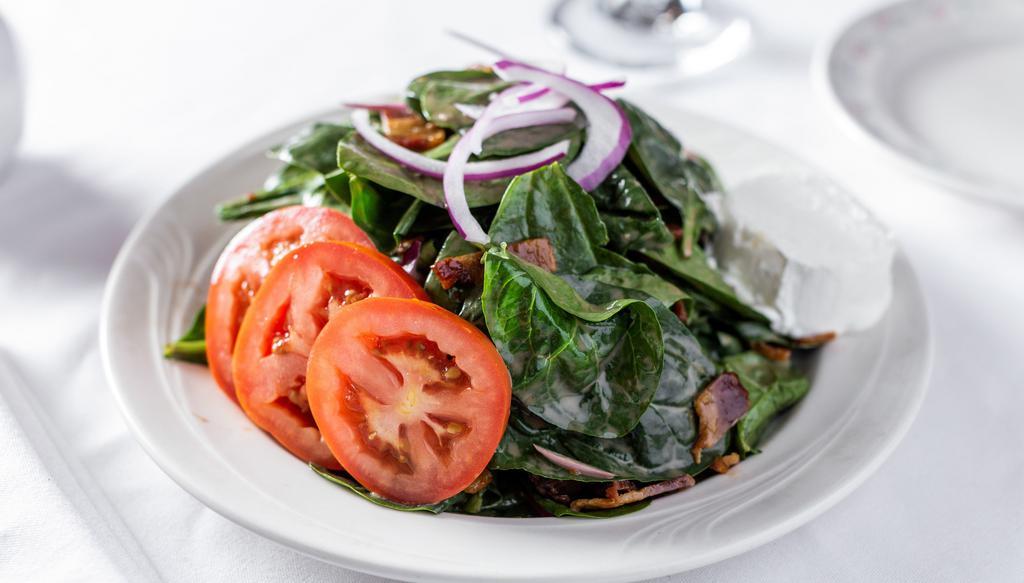 Spinach Salad · Warm goat cheese, red onion, and our very own bacon-balsamic vinaigrette.