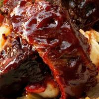 Bbq Glazed Beef Short Ribs · Horseradish whipped potato and red wine demi-glace.
