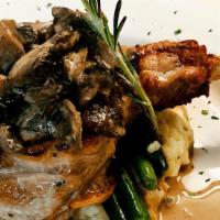 Veal Chops · Veal chops, potato puree, mushroom cream sauce, haricots verts.