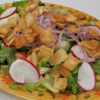 Fattoush Salad · Chopped Romaine lettuce, tomato, onion, cucumber, parsley, radishes and sumac topped with ol...