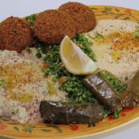 Veggie Combo · Three falafel, three grape leaves, hummus and tabouleh salad. babaghannouj, pita bread and a...