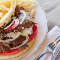 Gyro Sandwich · Gyro meat served on a pita with tomatoes, onion and tzatziki cucumber sauce.