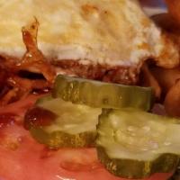 The Western Ave Burger · #1 Seller - smothered in our homemade Guinness BBQ sauce, topped with crispy onions, bacon a...