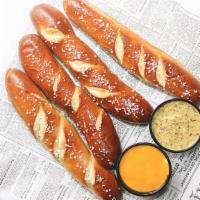 Bavarian Pretzel Stricks · Great to share! Served warm and soft with a side of Merkt's Cheddar cheese dipping sauce.