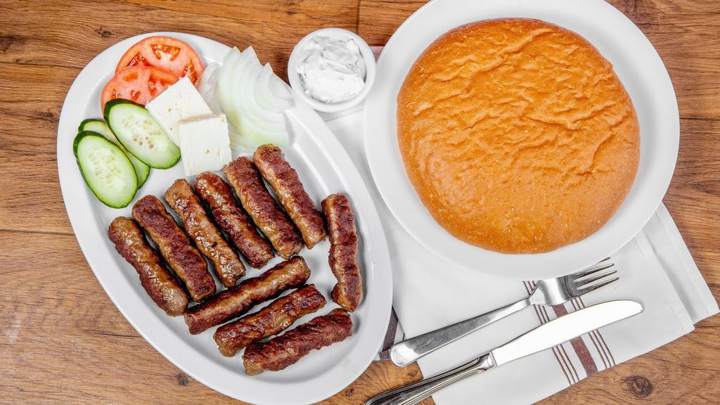 Our Famous Kebab Plate · Cal. 698 10 made in house ground beef seasoned sausage links served with a side of feta cheese, tomatoes, raw onions, cucumbers & fresh Lepinja bread Served with a side of gyro sauce or kaymak 