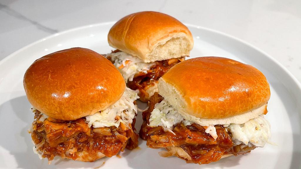Pulled Pork Sliders (3) · Pulled pork tossed in Smokeheads Carolina BBQ Sauce, topped with our house slaw. Served on a soft brioche bun.