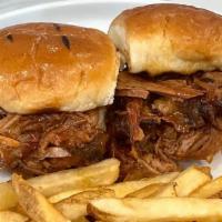 Kids Pulled Pork Sliders (2) · Tossed in Texas Mop Sauce and served with Seasoned Fries