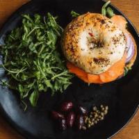 Ora-King Salmon Bagel · Sustainable smoked salmon, tomatoes, cream cheese, red onions, capers on toasted bagel.