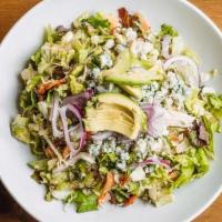Chopped Cobb · Leaf lettuce, poached chicken, tomatoes, red onions, avocado, Gorgonzola, bacon, hard boiled...