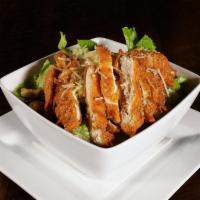 Crispy Chicken Caesar Salad · Crispy chicken, romaine lettuce, shredded parmesan garlic croutons, tossed in rustic caesar ...