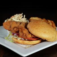 Fried Chicken Sandwich · Crispy chicken breast, your choice of buffalo sauce, lettuce, tomato, onion, fries.