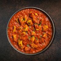 Chicken Vindaloo Wonder · Boneless morsels of chicken slow-cooked in a hot and tangy traditional masala. Served with a...