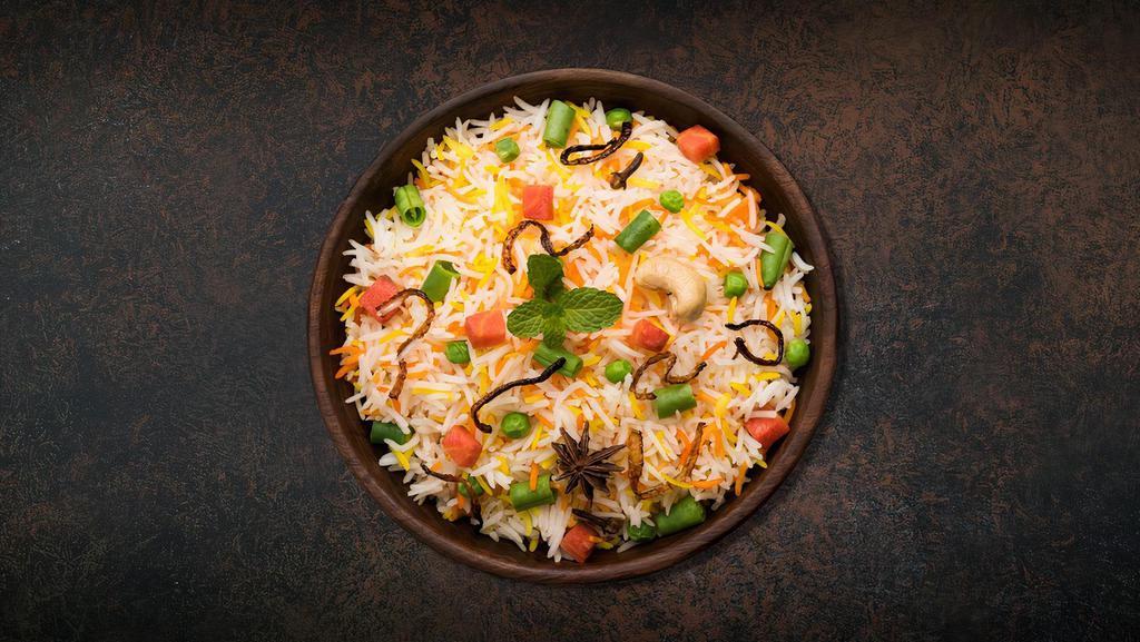 'Licious Veggie Biryani · Long grain basmati rice cooked with garden fresh vegetables in a blend of indian exotic spices and herbs.