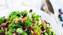 Superfood Kale Salad · Kale, brussels sprouts, dried cranberry, pumpkin seeds, chicory, poppyseed dressing