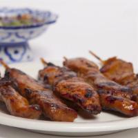 #6 Moo Ping · Marinated grilled pork skewers (6pc)