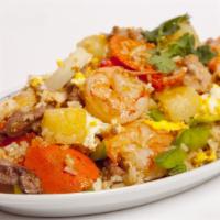 #65 Kao Pad Suparod · Pineapple fried rice with egg, onions, & a. combination of: beef, chicken, pork & shrimp