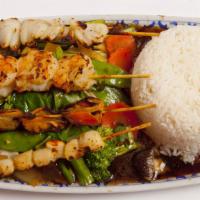 #115 Marinated Skewers · Grilled & served over mix vegetables and rice