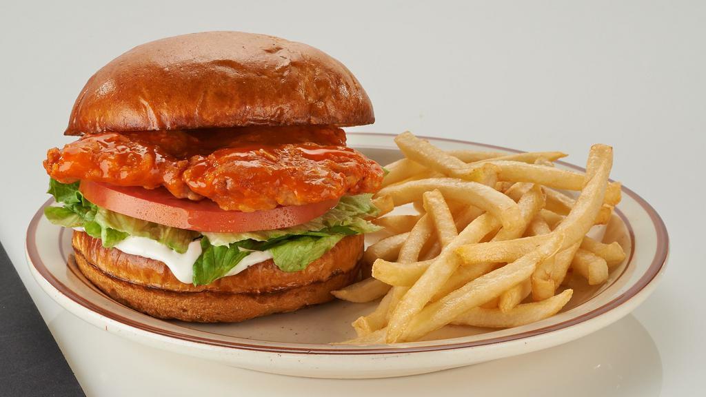 Grilled Or Crispy Chicken Breast Sandwich** · Delicately seasoned your choice of grilled or crispy chicken. Comes with lettuce, tomato and your choice of BBQ sauce, ranch or frank's red hot wing sauce.