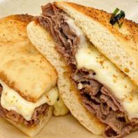 M&P Dip Sandwich · Sliced roast beef and Provolone cheese on a toasted garlic ciabatta roll served with a side ...